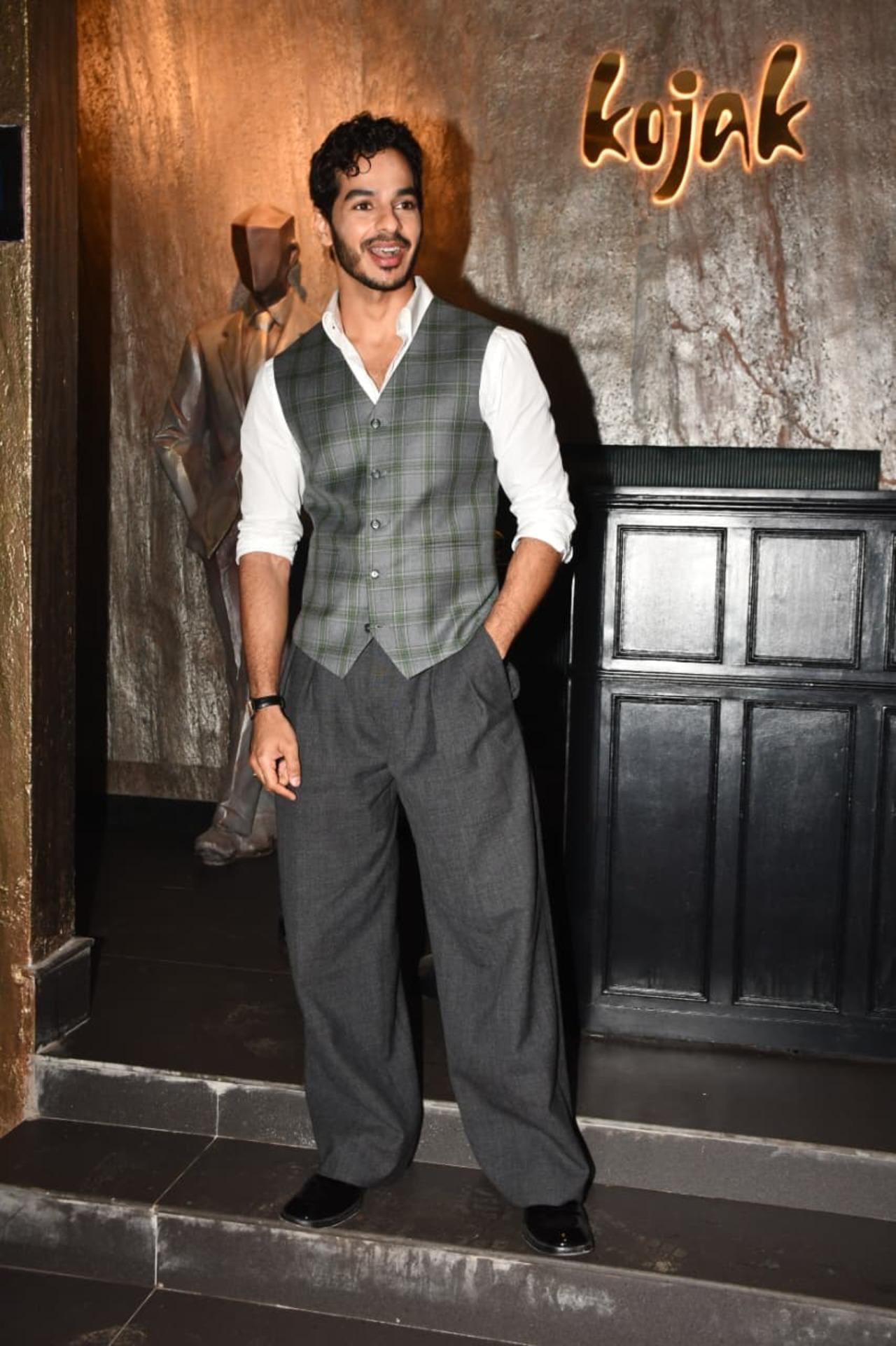 Ishaan Khatter keeps it effortlessly suave in this classic, tailored look. He pairs a crisp white shirt with a muted grey plaid waistcoat.